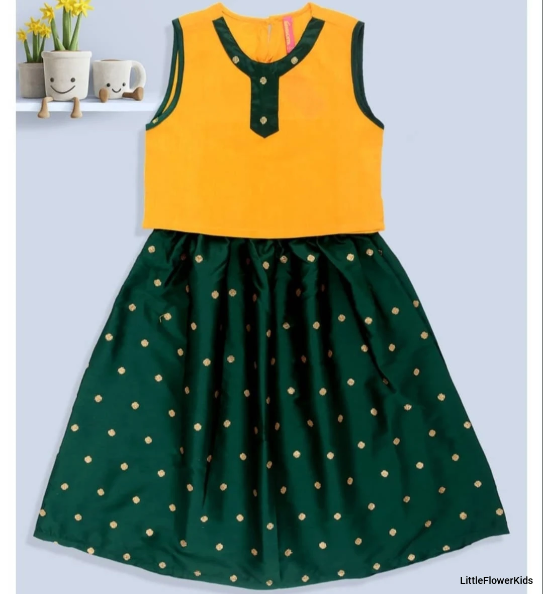 Yellow top with polka print green skirt