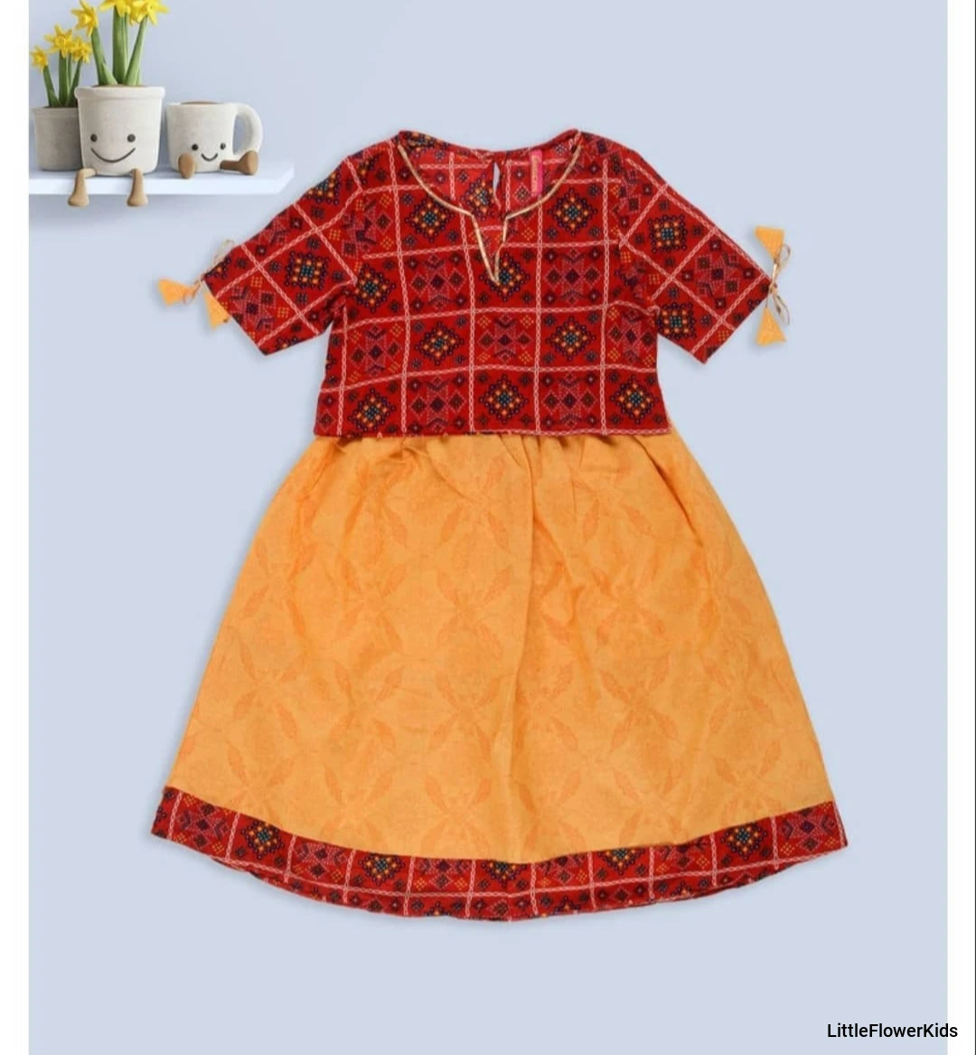 Red top with yellow skirt